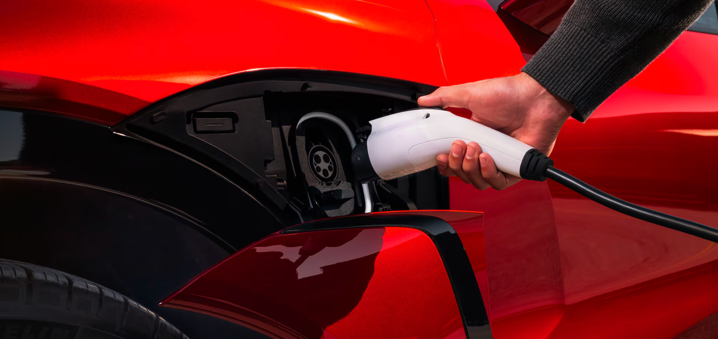 Charging port of red 2026 Chevy Blazer EV for sale in Marietta, OH